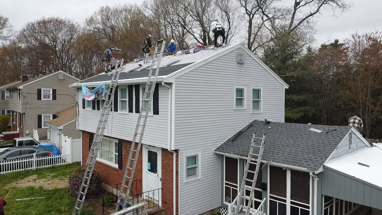 Storm King Roofing crew installing a new asphalt shingle roof